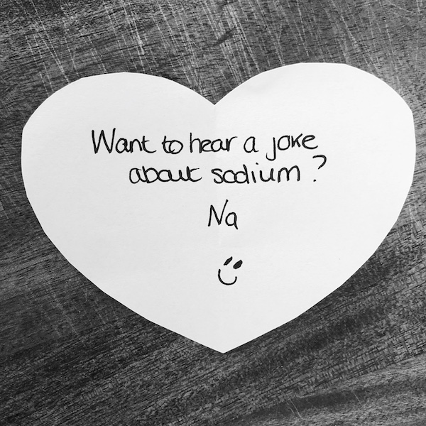 Science joke for kids on a white paper heart: