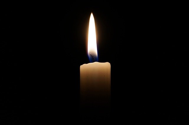 A candle in a dark room used to simulate the Sun