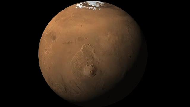 Mars showing Olympus Mons, the largest volcano in the Solar System